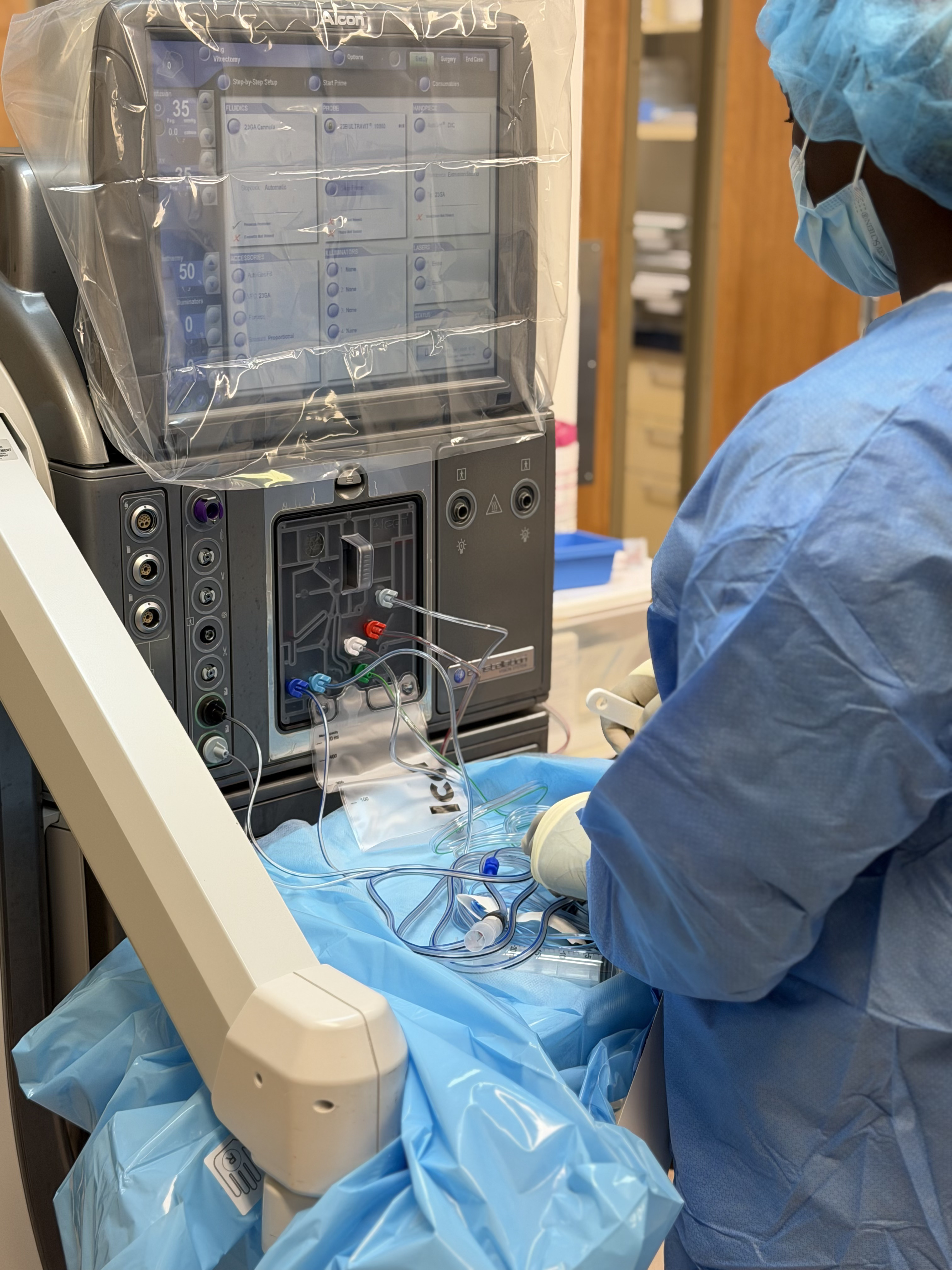 Ophthalmic surgeon performing cataract surgery under an operating microscope