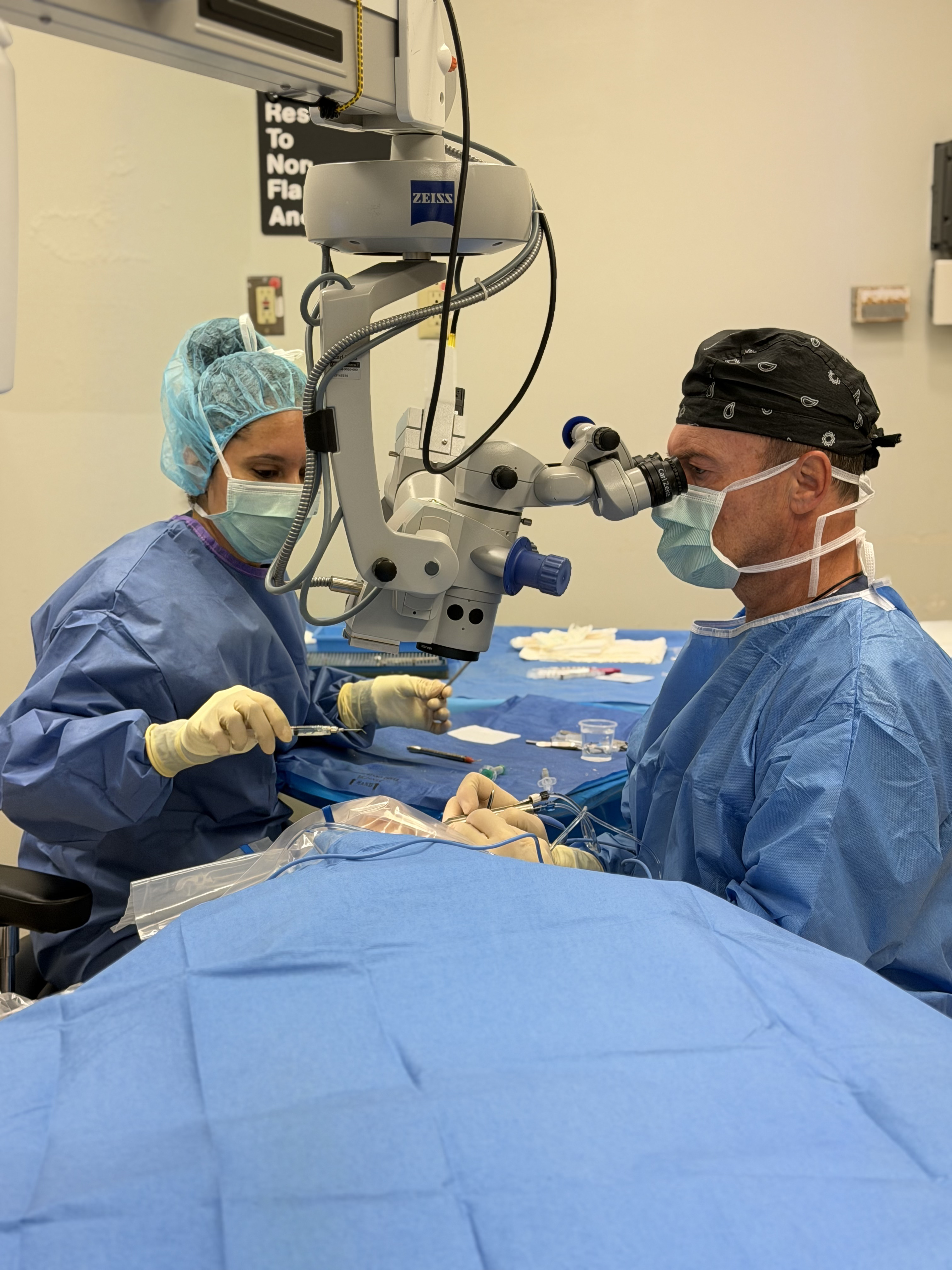 Surgeons performing advanced ophthalmic surgery in our Brooklyn operating suite